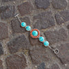 7.5" Reconstituted Turquoise and Coral Sunburst Toggle Bracelet