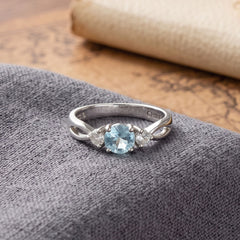 Rhodium Plated Blue Topaz and CZ Ring